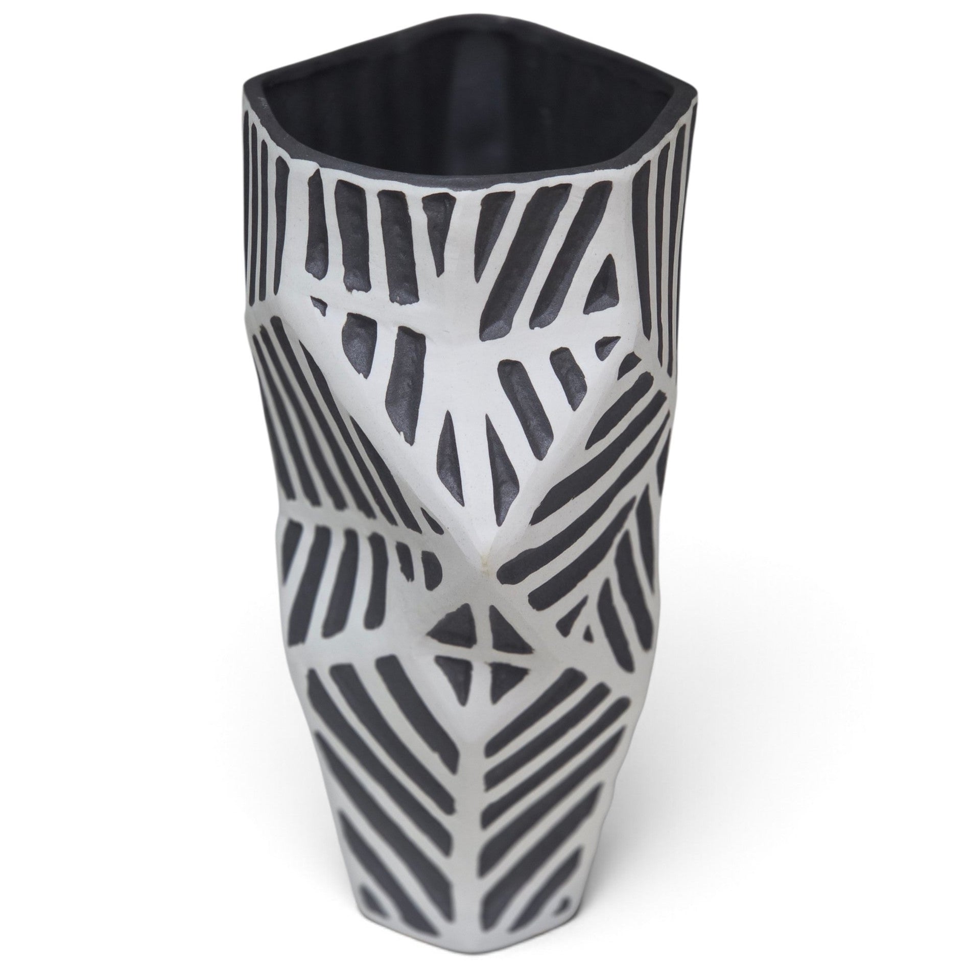 A modern hexagonal ceramic vase with a faceted, geometric design featuring a black and white leaf-like pattern, shown on a plain white background.