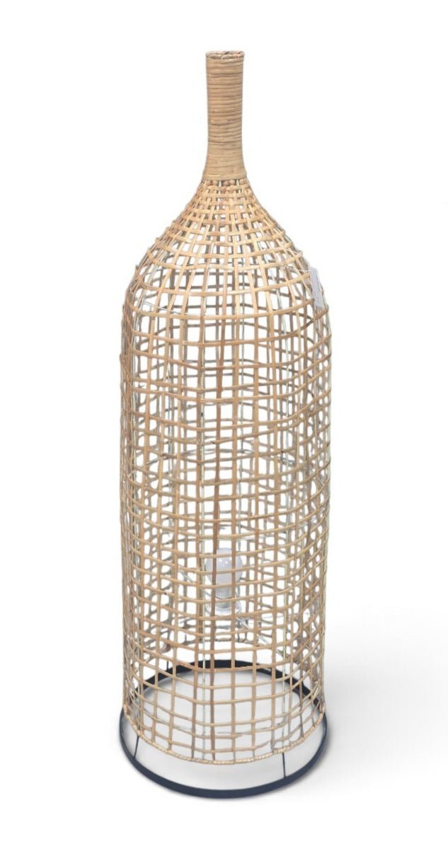 A tall decorative bottle-shaped cage or planter made of woven natural rattan or wicker, standing on a round base against a plain white background.