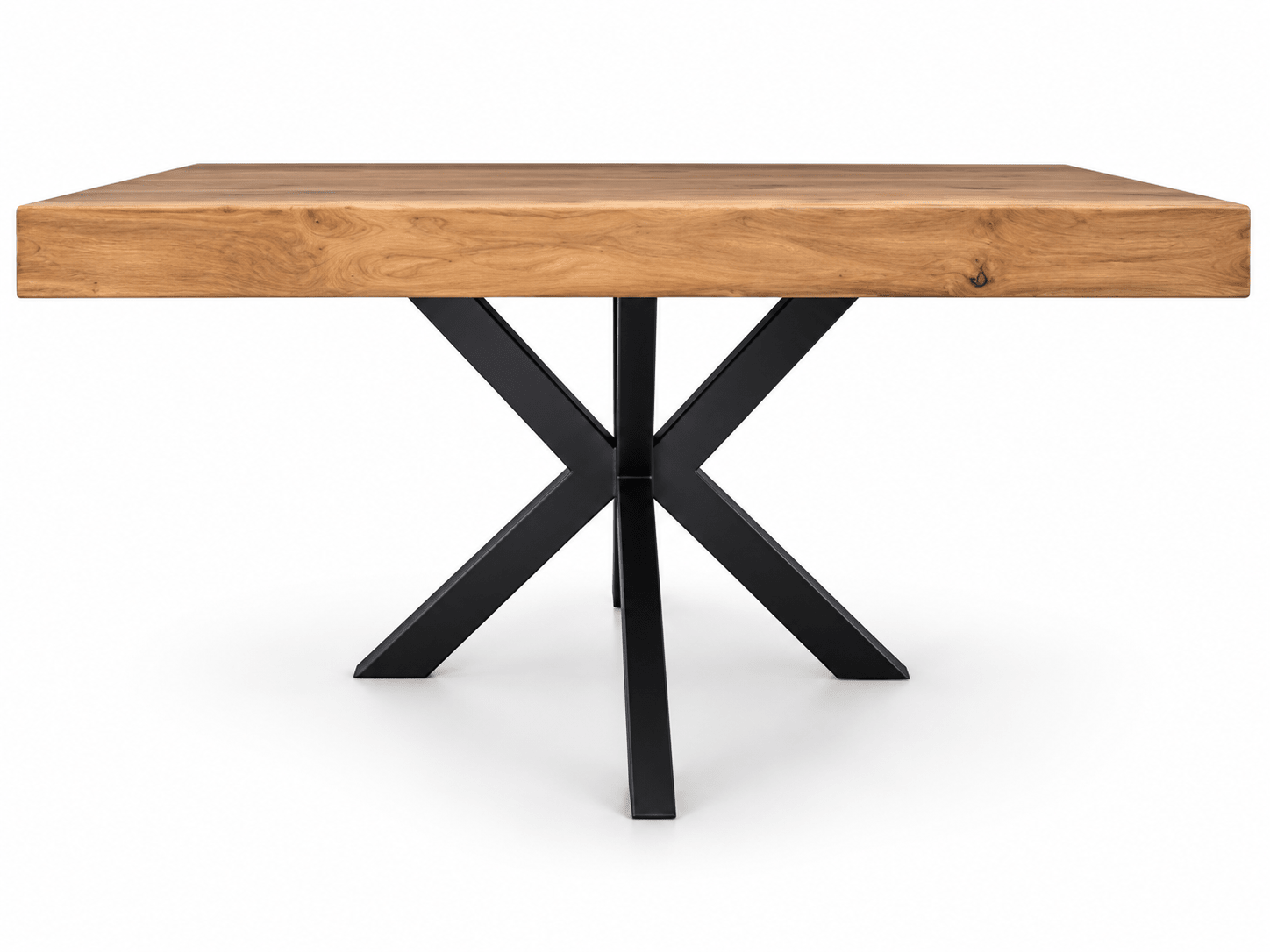 A modern dining table featuring a thick, rectangular live-edge wood top in a warm oak tone, supported by a black metal X-shaped base, shown against a plain white background.