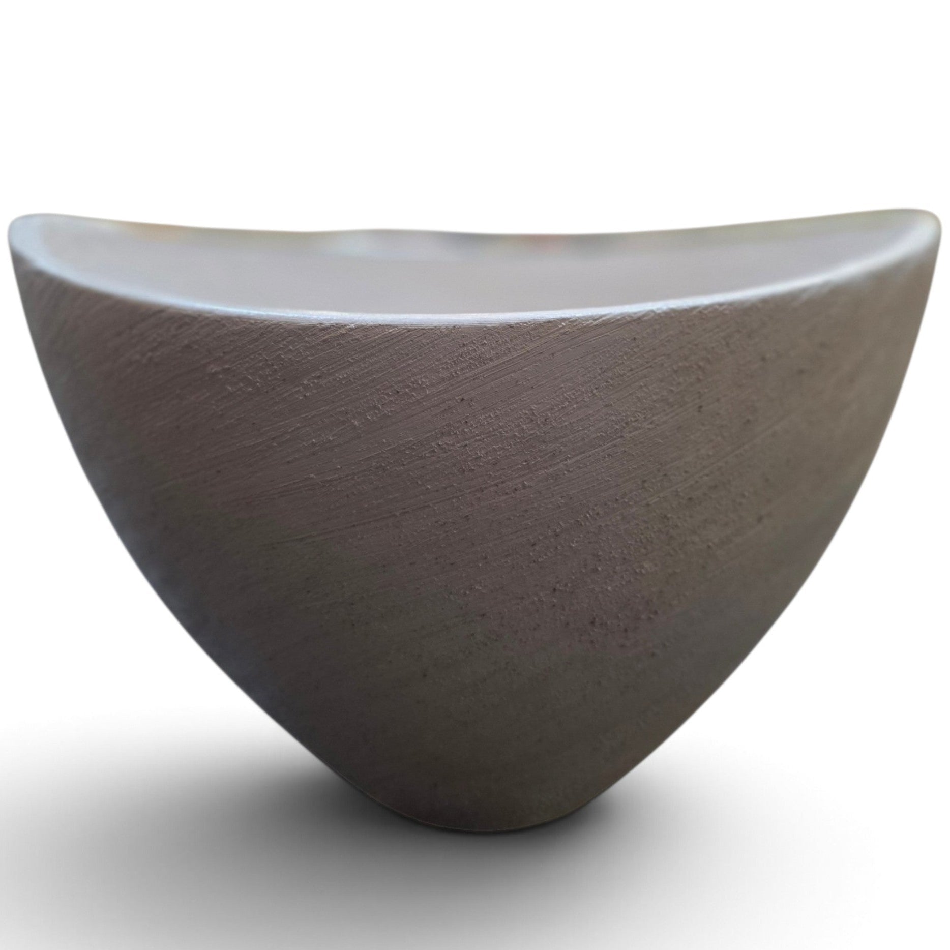 A modern, asymmetrical ceramic bowl with a textured matte finish, shown on a plain white background with a soft shadow.