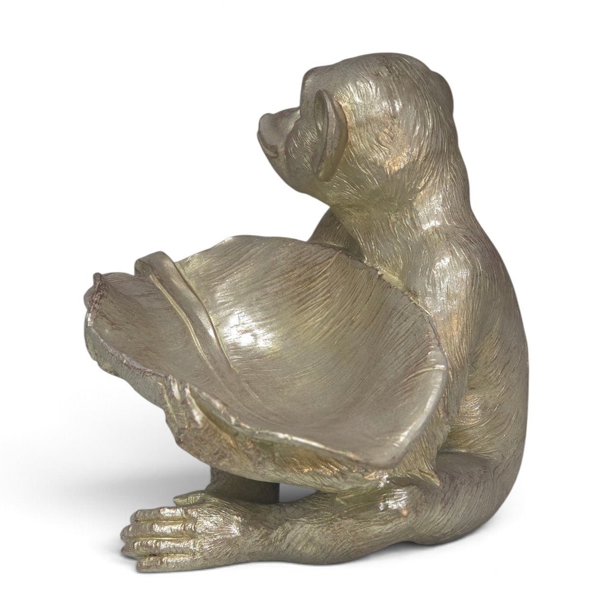 A metallic bronze-finished figurine of a sloth holding a shell, shown against a plain white background.