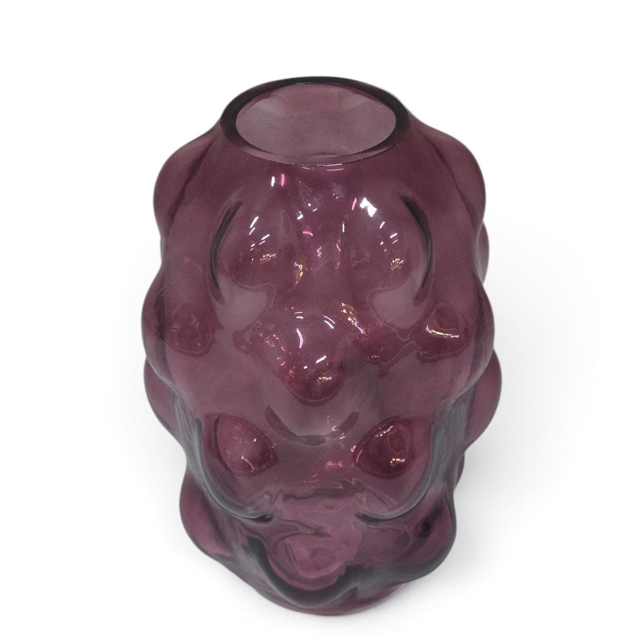A translucent purple glass vase shaped like a stylized animal head, photographed on a clean white background.