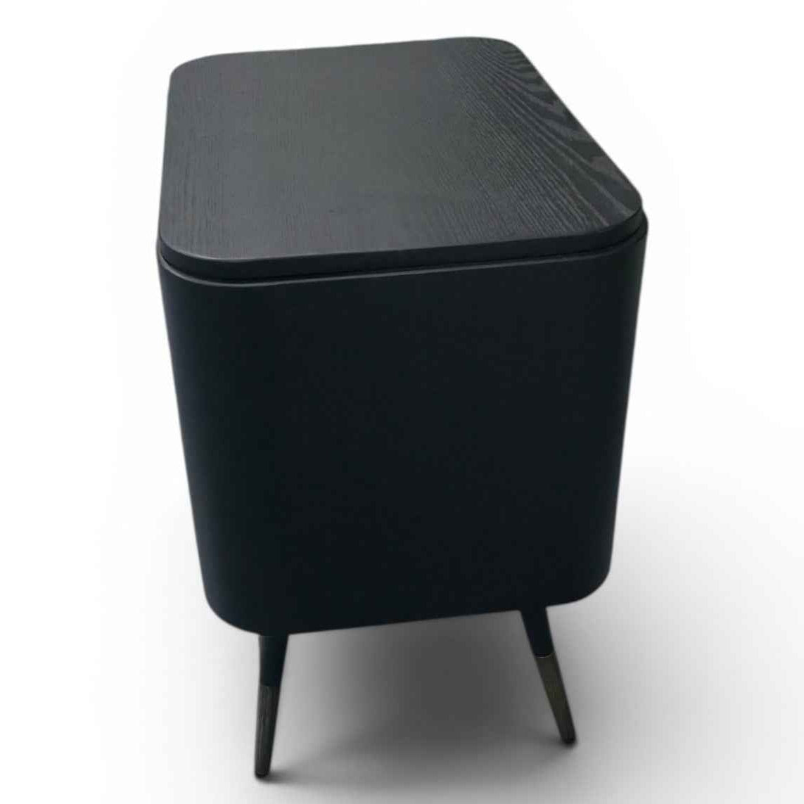 Black rectangular table with textured surface on a white background