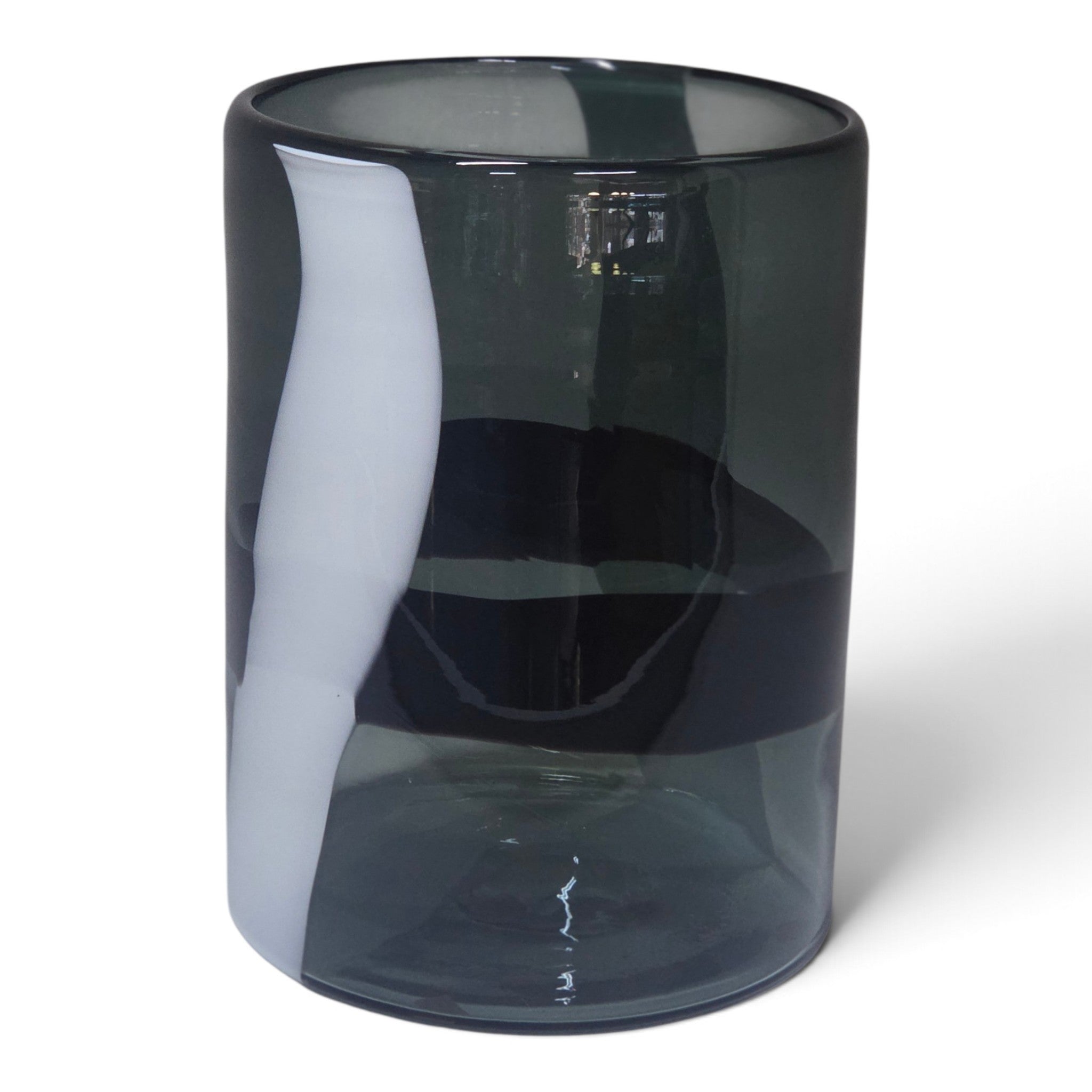 A dark smoky gray translucent glass tumbler with a glossy finish, shown on a plain white background.