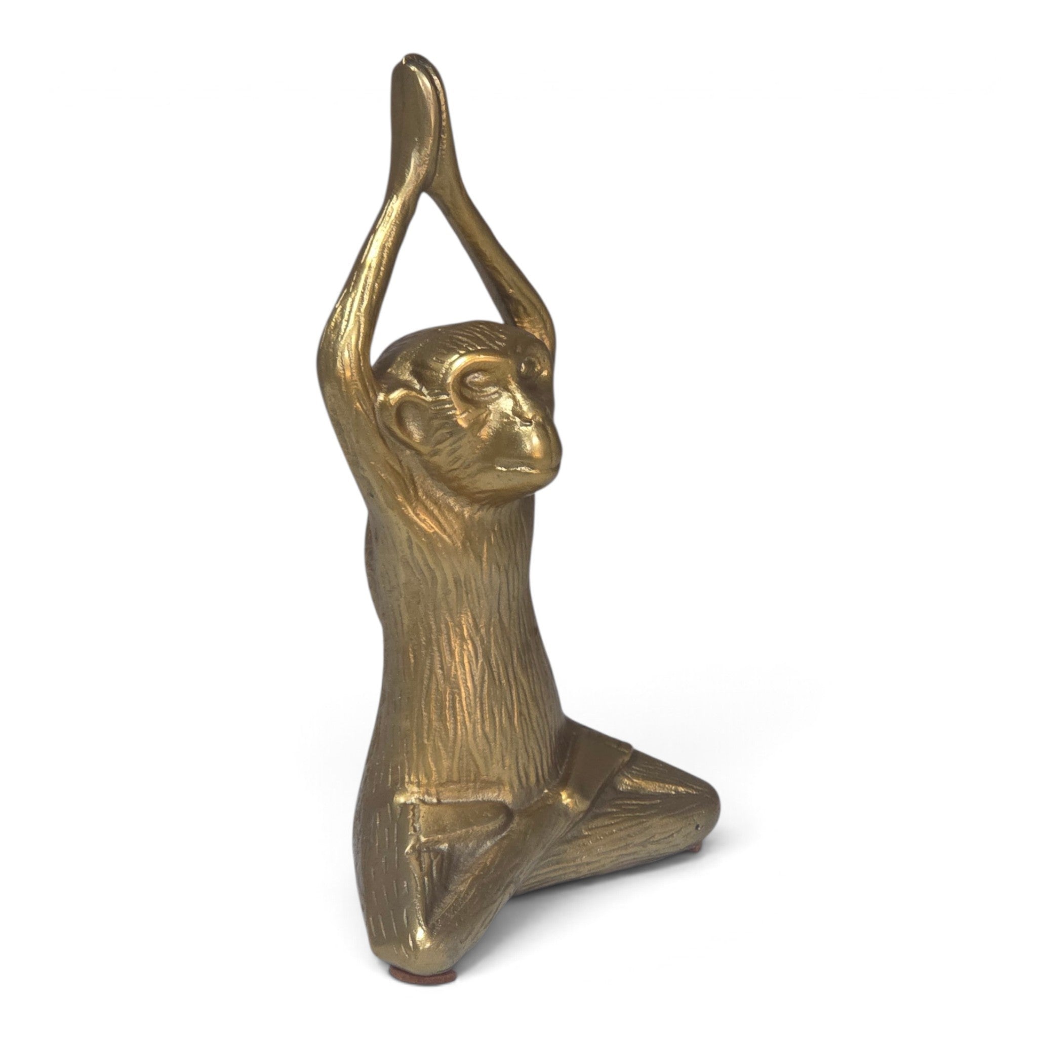 A small metallic monkey figurine in a kneeling pose with both arms raised overhead, shown on a plain white background.